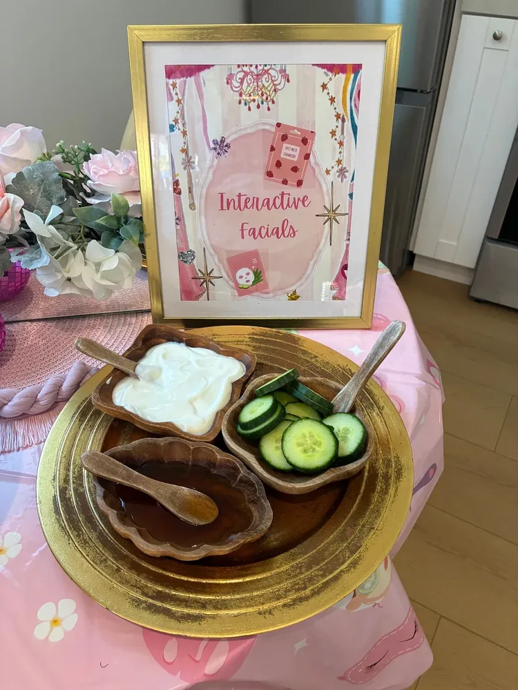 Cucumbers and facial cream beside an interactive facials sign.